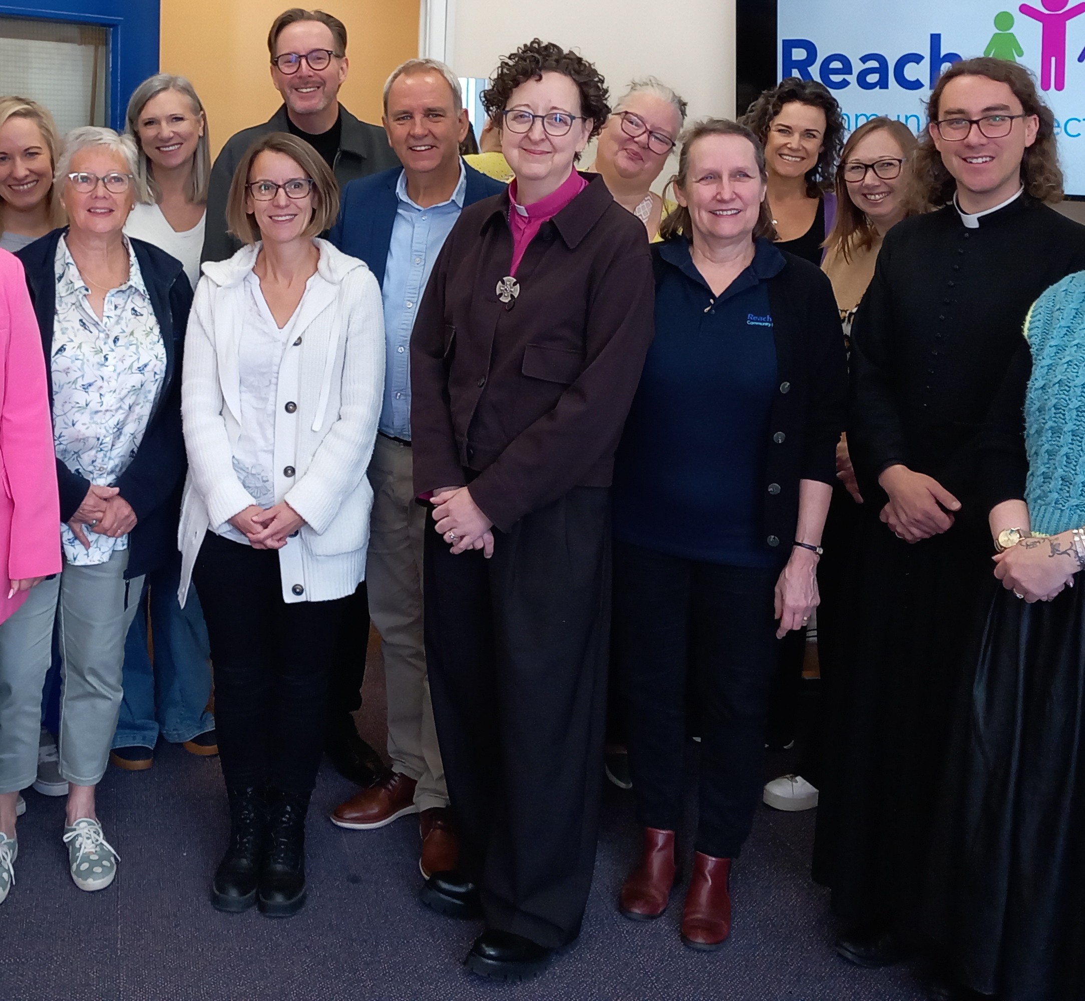 Bishop Joanne stood with people at a food bank