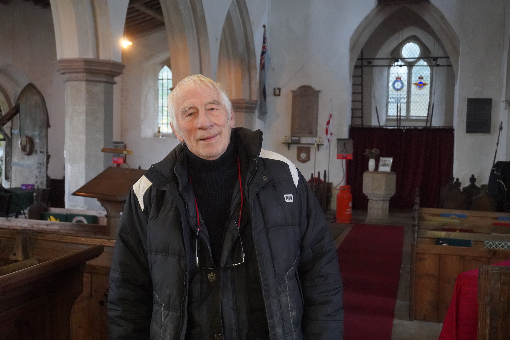 Churchwarden Peter standing inside St Margaret’s Church in Stradishall